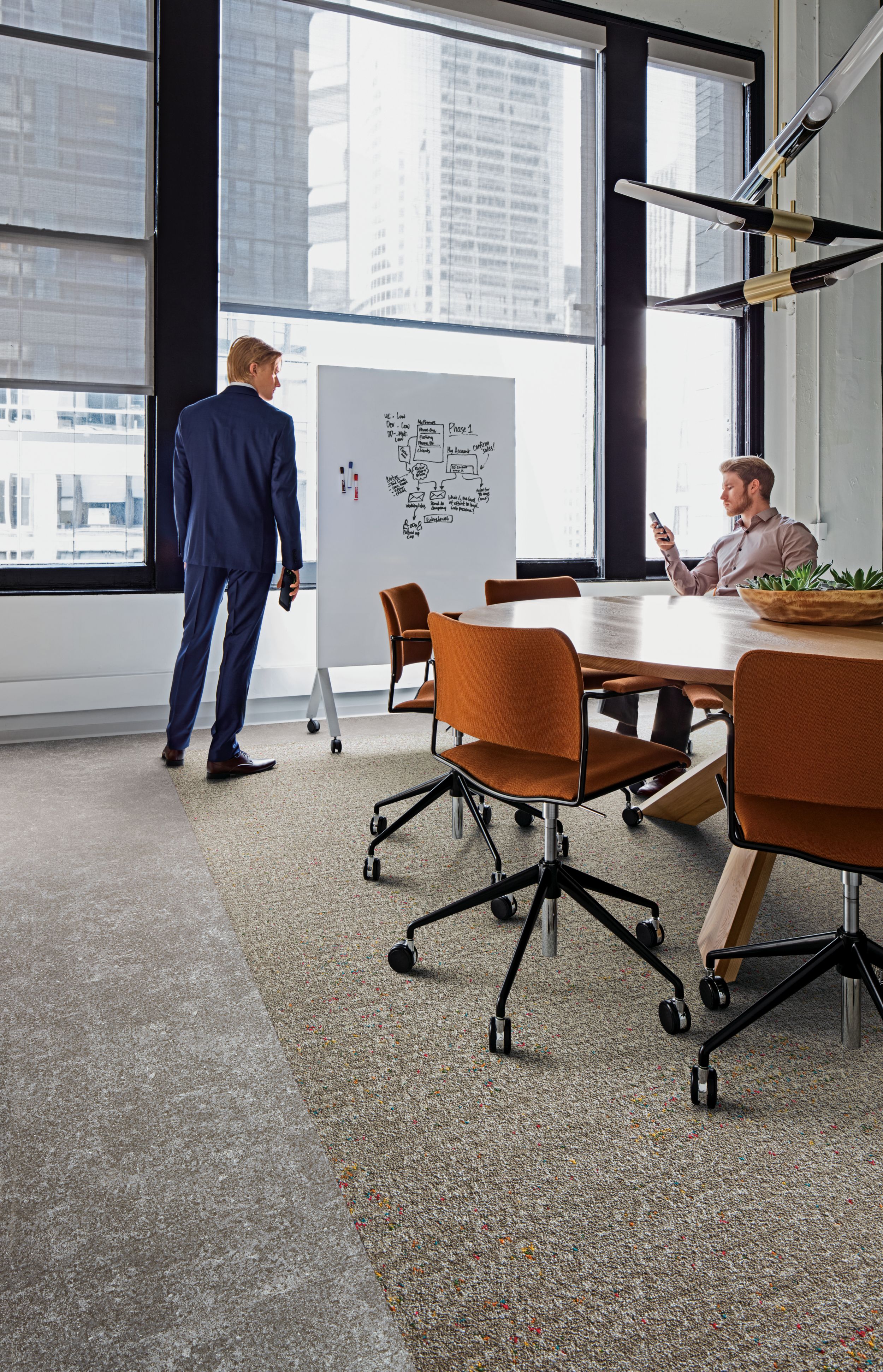 Interface Walk of Life LVT and Step Aside carpet tile in meeting space with conference table and chairs image number 3